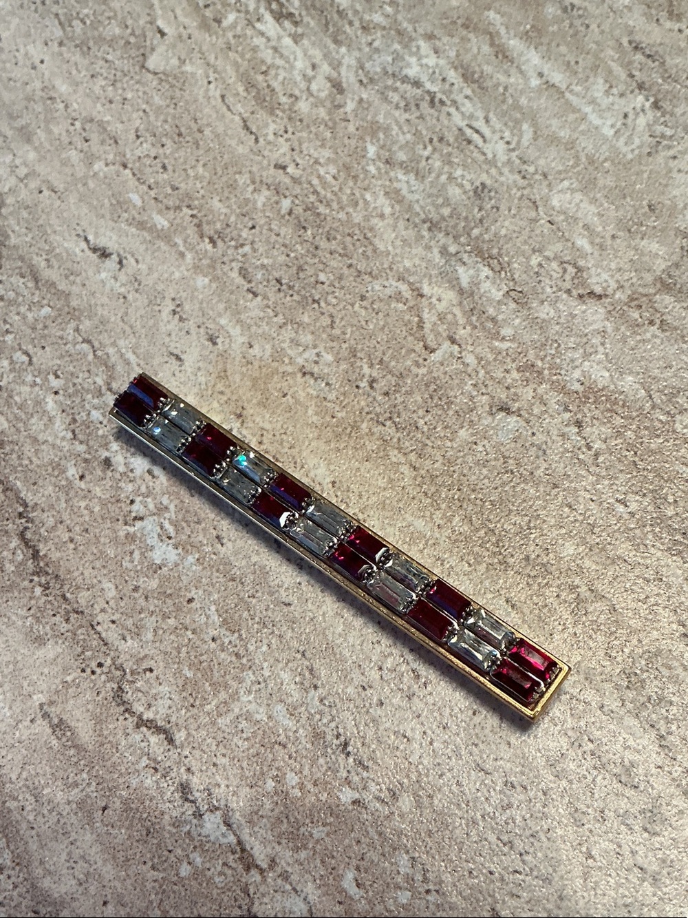 Art deco style baguette ruby and crystal bar brooch.